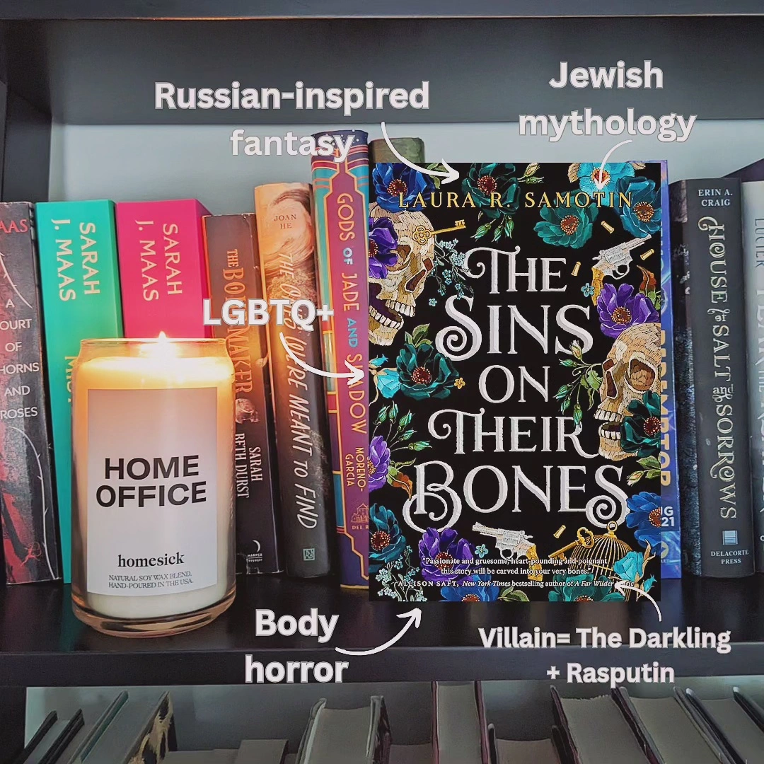 The Sins on Their Bones on a bookshelf next to Home Office candle